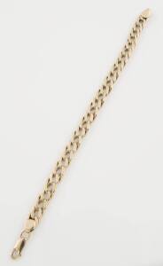 A flat curblink bracelet. 9ct yellow gold. Length 21cm. To be sold with extra links. Total weight 25.24 grams. 