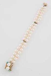 A cultured pearl bracelet, the double strand bracelet hung with a pearl and turquoise clasp. 14ct yellow gold. Length 18cm. 