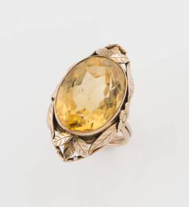 A citrine cocktail ring, of foliate and floral design. 9ct yellow gold. Size M. Weight: 8.55 grams. 