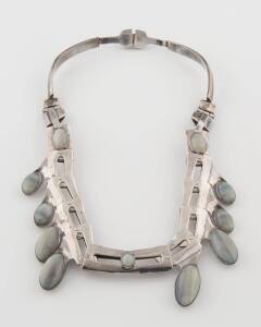 An opal collar, of industrial design and set with white cabochon opals. Sterling silver. 