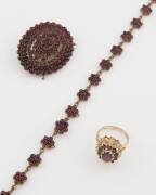 A Bohemian garnet suite, comprising a brooch, ring and bracelet (A/F). 9ct yellow gold and copper. Ring size N. 