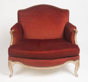 A Louis XIV style white painted & red velvet bergere. 