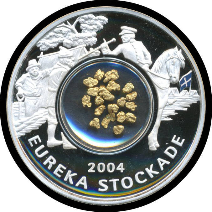 ONE DOLLAR: 2004 $1 Eureka Stockade Proof Locket coins, 0.782oz 99.9% silver incorporating a central locket containing a selection of small gold nuggets (0.3g) in timber presentation case with outer packaging, as new. Current retail $1400. (10)