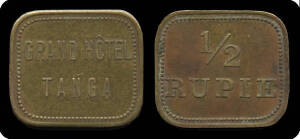 EAST AFRICA: German East Africa ½ rupee 'GRAND HOTEL TANGA' brass token, reverse '½ / RUPIE' surrounded by beaded border, rectangular (20mm x 23mm), VF. The first token of this type we have seen.