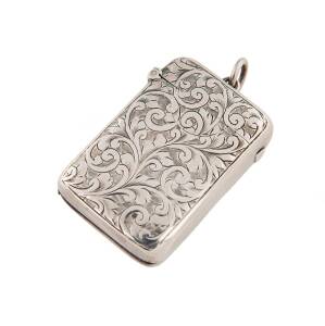 SILVER WARE: c.1906 Chester case 4½x3½x1cm with engraved pattern, snugly fitting lid & a small loop for attaching to a fob-chain, two vertical compartments for stamps & matches, two hallmarks on the back of the lid.