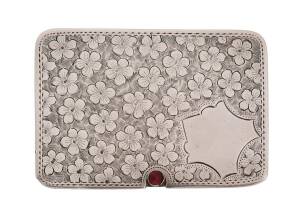 SILVER WARE: c.1908 Ahronsberg Brothers (Birmingham) flat case 5x3½cm with floral design, slide-out tray with two compartments & an inset garnet, hallmarks on the reverse and within.