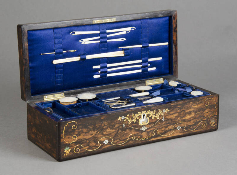 SEWING WORKBOX: Mid 19th century Coromandel box beautifully inlaid with brass & shell, fitted blue silk interior with handsome collection of bone, ivory & mother of pearl sewing implements. 30 x 12 x 9cm