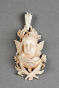 DIEPPE IVORY PENDANT: Beautifully carved cherub amongst flowers & foliage, French c1870s. VG condition