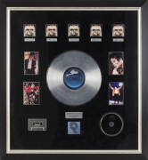 MICHAEL JACKSON PLATINUM RECORD: RIAA certified platinum record display, "Commemorating the sale of more than 5 Million copies of Michael Jackson's Album, Cassette and CD "DANGEROUS", framed & glazed, overall 80x86cm.