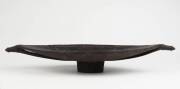 A FEASTING BOWL. Schouten Islands, Papua New Guinea. Carved wood & pigment. 56 x 28 x 8.2cm