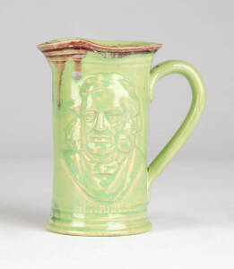 PAMELA: Rare pottery jug incised "HENTY. Portland Centenary 1834-1934" with portait of Edward Henty (pioneer first permanent settler of the Port Phillip district later called Victoria). Glazed in bright green with red rim & blue interior. 12.5cm