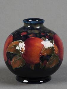 MOORCROFT: pomegranate patterned spherical vase with incised signature and "Potter to H.M. The Queen". 11cm. VG condition