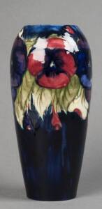 MOORCROFT: Pansy patterned vase on blue ground c1930. Stamped "Moorcroft. Made in England" with underglaze signature. 26cm. VG condition