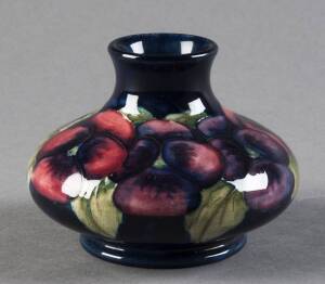 MOORCROFT: Pansy patterned squat vase on blue ground c1930s. 8 x 10cm. VG condition