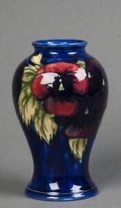 MOORCROFT: Pansy patterned vase on blue ground circa late 1930s. Inverted balluster shape. 16cm. VG condition