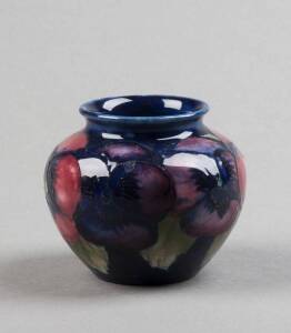MOORCROFT: Miniature Pansy patterned vase on blue ground.circa late 1920s.  6.5cm. VG condition 