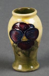 MOORCROFT: True miniature Pansy patterned vase on yellow & green ground. Height 5cm, width 3cm. VG condition