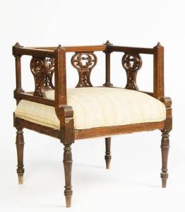 Edwardian walnut ladies tub armchair with square back, upholsered in gold Regency striped fabric.