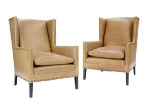 Pair of tan leather armchairs purchased from Reidel Imports of Hawthorn.