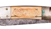 An impressive whaler's knife with tortoise shell, mother of pearl & marine ivory handle engraved with a kangaroo on one side & a British lion on the other, housed in leather sheath. Early 19th Century. 46.5cm - 2