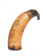 A powder horn with scrimshaw decoration of tall ship, harp, village scene etc., early 19th Century. 