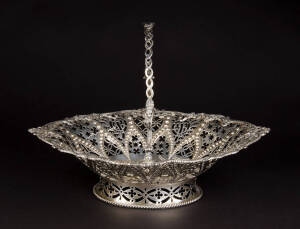 STERLING SILVER BREAD BASKET: Mid Victorian with beautiful pierced bowl & swing handle. Engraved with crest. Made by Robert Harper of London c1857. Very impressive weight 1.050 kg. 35 x 32 x H.26cm. Excellent condition