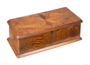 WILLIAM NORRIE New Zealand inlaid timber glove box, mottled kauri, puriri, rewa rewa, burr totara and maire, c1890. 11cm high, 33cm wide, 14cm deep