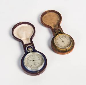 Two pocket barometers in leather travel cases, 19th Century. Largest, 5cm diameter.