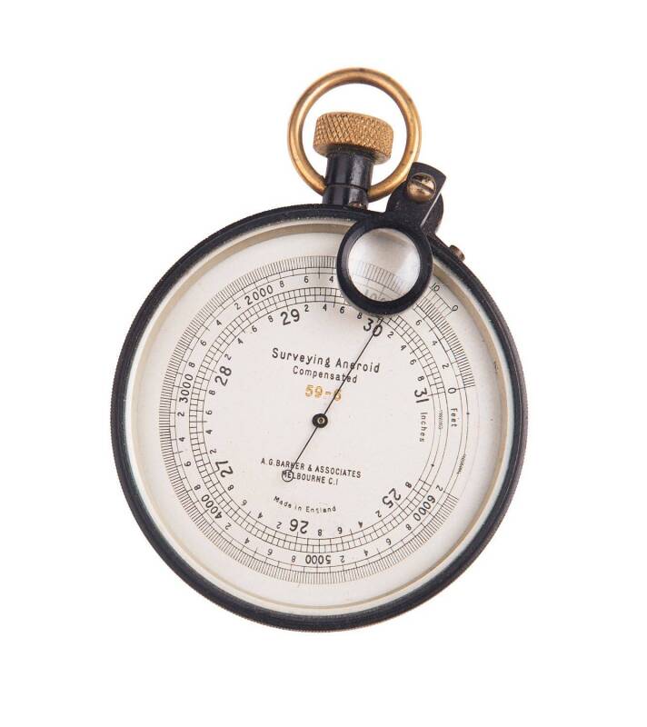 Aneroid portable barometer in leather carry case. Made in England for A.E.Barker & Associates of Melbourne. This model was used by surveyors and is temperature compensated; it can also be calibrated for height up to 6000 feet. 8cm diameter