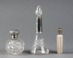 Antique scent bottle with gilt silver top on white overlay glass; plus 2 silver topped vanity bottles.