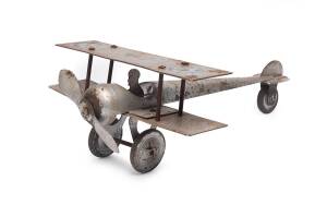 "The Joey" metal toy airplane by Digger Jnr. made in South Australia, circa 1918 to 1924. 35cm long.
