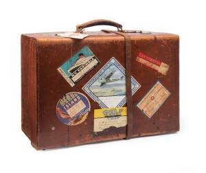 Vintage leather travel case with interesting array of Australian aviation related travel stickers etc., circa 1920's. 41cm high, 56cm wide, 22cm deep. 