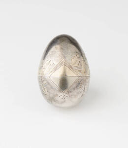 RUSSIAN SILVER EASTER EGG; with engraved floral design, gilt interior and highlights. 5 x 4cm VG condition