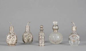 SILVERWARE: Group comprising 3 Chinese silver Angostura Bitters bottles (some damage); Victorian sterling silver top crystal vanity bottle with glass crown stopper; South Asian silver finished perfume bottle. Mixed condition