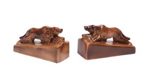 A pair of pottery dog bookends, 20th Century. Signed "Atholl". 21.5cm long. 