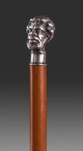 JULIUS HOGARTH Australian silver topped cane with cast and chased scuptured head of "Ricketty Dick" stamped "J.HOGARTH" with conjoined letters "TH". Mid 19th Century. 84cm.