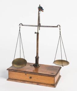 Set of gold scales mounted on timber box with set of 6 Dram weights, 4 shim weights and 2 lozenge weights, mid 19th Century. 33cm high, 23cm wide, 12cm deep. Provenance: Private collection Ballarat