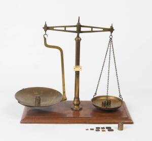 A set of gold buyer's scales, mid 19th Century, purported to have been used on the Ballarat gold fields, together with assorted weights. 44cm high. Provenance: Private collection Ballarat