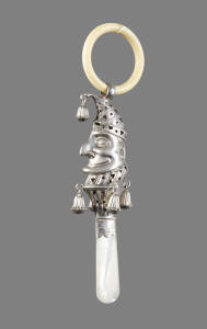 BABY RATTLE: "Punch"  sterling silver head with shell handle & ivory ring. By Crisford & Norris of Birmingham c1905. 17cm