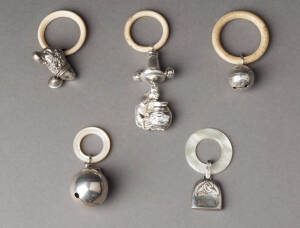 BABY RATTLES: Group of 5 silver rattles with ivory, bakelite & pearl shell rings.