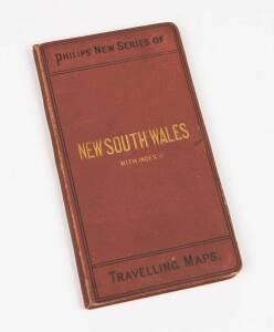 NEW SOUTH WALES with Index: [London, George Philip and Son, c1890] A colour map (490x300mm) laid onto a single linen sheet (54 x 65 cm), folded and cased in brown cloth covers, lettered in black and gilt, an Index booklet (19pp, with wrappers, 17.5x9.5 cm