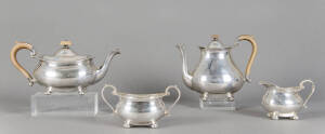 STERLING SILVER: English tea service comprising tea pot, hot water pot, milk jug & sugar basin. Made by Suckling Ltd. Birmingham 1935-1939. Carved wooden handles & finials, small dent to the jug. Beautifully crafted & weighing in at an impressive 1.880 kg