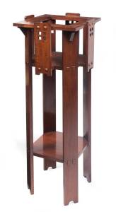 An Australian blackwood pedestal pot stand in the arts and crafts style