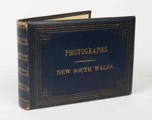 "PHOTOGRAPHS. NEW SOUTH WALES" leather bound collection of sepia albumen images tipped into the album. [Sydney : Charles Potter, Government Printer], 1889. Album of mounted [100] albumen silver print photographs. Oblong quarto, full blue morocco blind sta