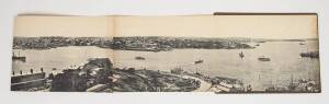 SYDNEY: A huge panoramic photogravure, circa 1905, comprised of 9 folding panels affixed to the backing board of what was the original cover. The view is taken from The Rocks area towards the East. Titled "SYDNEY" in the plate. 21 x 258 cm. 