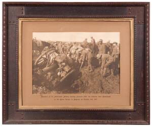 FRANK HURLEY: "Members of an Australian Battery hauling forward after the advance near Hannebeek, in the Ypres Sector, in Belgium, on October 4th, 1917" brown-toned carbon print in contemporary frame; 36 x 50cms (image size).