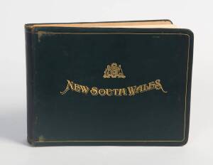 "NEW SOUTH WALES" titled c1934 green leather bound album of sepia photographs printed on cream-coloured pages and with titles printed in blue; the average image size being 150 x 200mm. The images are in very good condition although the binding is somewhat