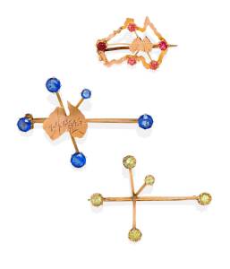 Three Southern Cross brooches, set with blue, green and red doublets. 9ct yellow and rose gold. Weight 7.29 grams.