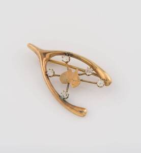 A gold wishbone and Southern Cross brooch, set with white sapphires. 9ct yellow gold. Weight 2 grams. Length 3.6cm.