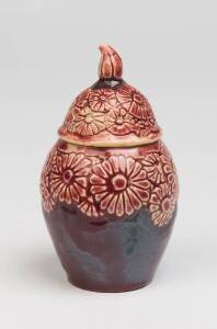 Marguerite Mahood (1901-1989) A wheel thrown red glazed earthenware covered pot